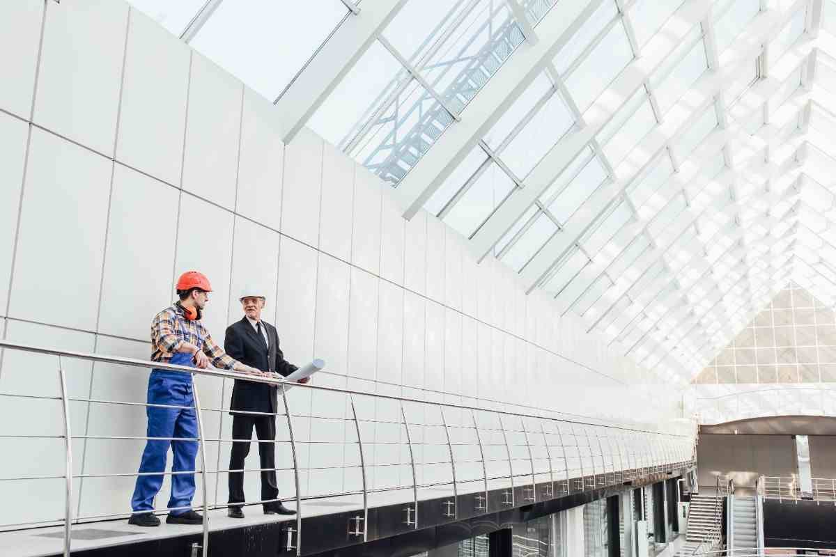 standing-industrial-engineers-blue-vests-helmets-50kb